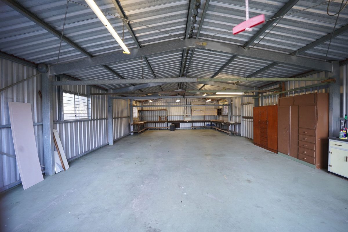 Empty garage shop with a smooth gray coated floor