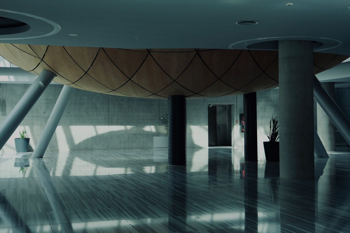 Dark high-gloss floor reflecting a modern interior