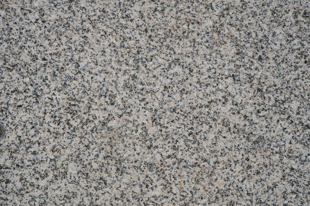 Close-up of a speckled gray and black stone surface
