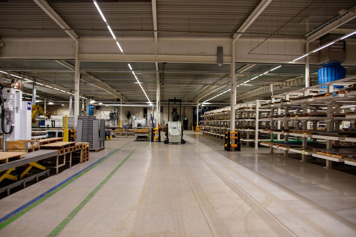 Industrial warehouse with a light coated floor and painted lane markings