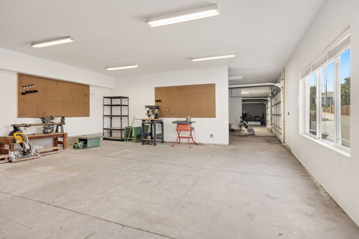 Bright workshop interior with a light gray coated floor